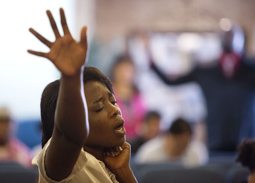 Lennie Mahler  |  The Salt Lake Tribune
Sandrine Ingabile worships during a service at the church of The Pentecostals of Salt Lake City on Sunday, May 12, 2013.