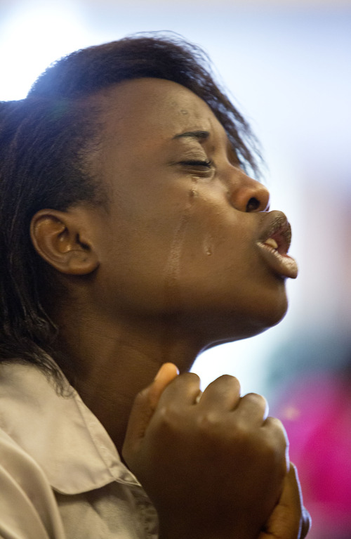 Lennie Mahler  |  The Salt Lake Tribune
Sandrine Ingabile worships during a service at the church of The Pentecostals of Salt Lake City on Sunday, May 12, 2013.