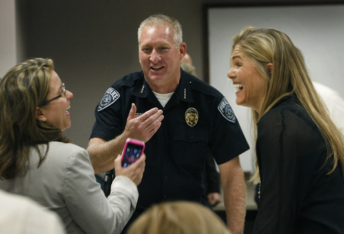 Scott Sommerdorf   |  The Salt Lake Tribune
Salt Lake County Sheriff Jim Winder laughs with Salt Lake County Deputy Mayor Nicole Dunn, left, and his wife Shawn Winder prior to receiving the Arthur Vivian Watkins Distinguished Service Award. The award honors elected officials who, through exceptional commitment, skill and integrity, serve the public with special distinction, Wednesday, May 22, 2013.