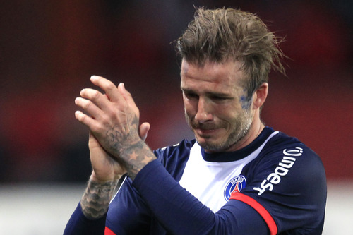 Paris Saint Germain's midfielder David Beckham from England cries as he leaves the field, during his French League One soccer match against Brest, at the Parc des Princes stadium, in Paris, Saturday, May 18, 2013. (AP Photo/Thibault Camus)