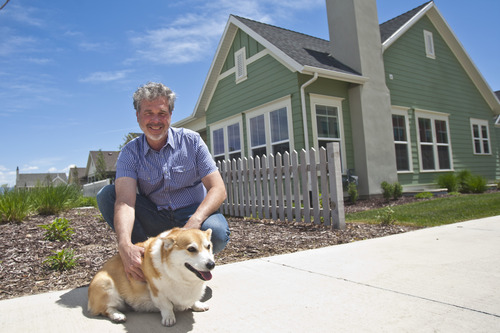 Chris Detrick  |  The Salt Lake Tribune
Doug Monroe poses for a portrait with his dog Duncan at their home in Daybreak in South Jordan Wednesday May 22, 2013.