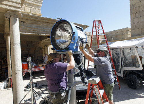 Al Hartmann  |  The Salt Lake Tribune
Lighting technicians set up a light on the "Old Jerusalem" movie set near Elberta, Utah Wednesday May 22.  The Church of Jesus Christ of Latter-day Saints is in the last few days of filming for the New Testament video library project (Bible Videos).