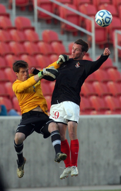 Kim Raff  |  The Salt Lake Tribune
Orem goalie (left) Ben Mitchell Bountiful forward (right) Garrett Rydalch collide in the air during the 4A State Championship at Rio Tinto Stadium in Sandy on May 23, 2013. Bountiful went on to win the game 2-0.