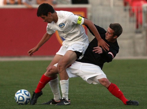 Kim Raff  |  The Salt Lake Tribune
Bountiful player (right) Kaleb Maynard kicks the ball from between the legs of Orem player Daniel Corbett during the 4A State Championship at Rio Tinto Stadium in Sandy on May 23, 2013. Bountiful went on to win the game 2-0.