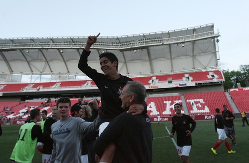 Kim Raff  |  The Salt Lake Tribune
Bountiful head coach Lou Plank picks up Cesar Duenas after defeating Orem in the 4A State Championship at Rio Tinto Stadium in Sandy on May 23, 2013. Bountiful won the game 2-0.