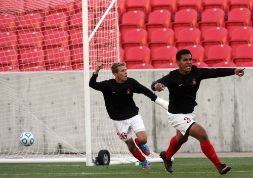 Kim Raff  |  The Salt Lake Tribune
Bountiful players (left) Alex Simpson and (right) Rylee Gautavai celebrate scoring a goal against Orem during the 4A State Championship at Rio Tinto Stadium in Sandy on May 23, 2013. Bountiful went on to win the game 2-0.