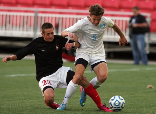 Kim Raff  |  The Salt Lake Tribune
Orem player (right) Q Bailey is knocked off his feet by Bountiful player (left) Carson Tinker during the 4A State Championship at Rio Tinto Stadium in Sandy on May 23, 2013. Bountiful went on to win the game 2-0.