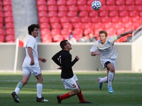 Kim Raff  |  The Salt Lake Tribune
Orem player Q Bailey heads the ball past Bountiful player (middle) Jake Haddock during the 4A State Championship at Rio Tinto Stadium in Sandy on May 23, 2013. Bountiful went on to win the game 2-0.