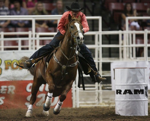 Kim Raff | The Salt Lake Tribune
The Cowboys Memorial Day Rodeo is May 24 and 25, 2013, in Castle Dale. In this photograph from July 21, 2012, Nancy Hunter competes in the barrel racing event during the Days of 47 Rodeo at the Maverik Center in West Valley, Utah.