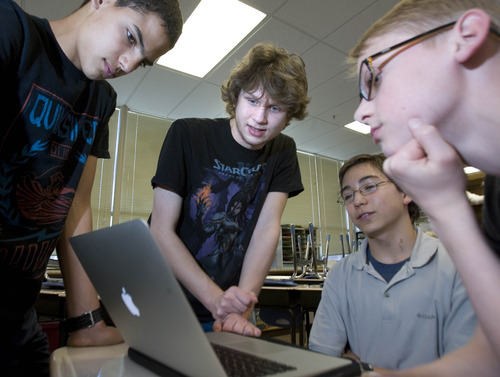 Paul Fraughton  |  The Salt Lake Tribune
Christian Seipp, center, teaches students at The Salt Lake Center for Science Education an after school computer programming class. Students are from left: David Sanchez, Isaiah Toritz, seated and Jack Mismash.