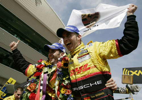 Penske Racing's drivers Romain Dumas, left, and Timo Bernhard celebrate after winning the overall American Le Mans Series' Utah Grand Prix Sunday, May 18, 2008 at the Miller Motorsports Park. The racers ran their cars all out on the 3.048 miles course for two hours and 45 minutes at the Tooele facility. 5/18/2008 Jim Urquhart/The Salt Lake Tribune