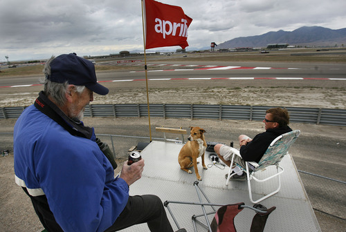 Scott Sommerdorf  |  The Salt Lake Tribune             
Neil Goodesll, left, and his son Jeff Goodsell and Jeff's dog "Puppy" watch the FIM Superbike World Championship free practice at Miller Motorsports Park, Sunday, May 27, 2012 from atop their motorhome parked near the Witchcraft turn.