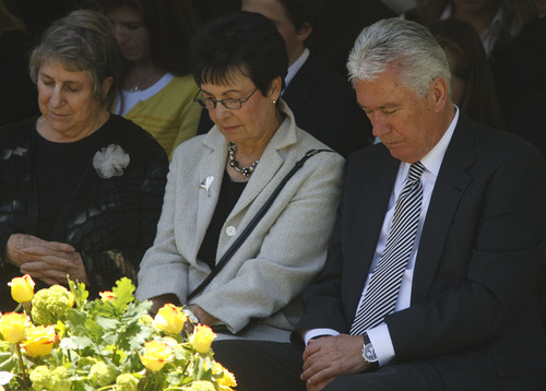 Leah Hogsten  |  The Salt Lake Tribune
President Dieter F. Uchtdorf and his wife, Harriet Reich Uchtdorf, pray at the gravesite of  Frances J. Monson, wife of LDS Church President Thomas S. Monson, who was laid to rest in the Salt Lake City Cemetery, Thursday, May 23, 2013. Frances Monson died Friday at age 85 after having been hospitalized for several weeks. The Utah-based Church of Jesus Christ of Latter-day Saints said she died of causes incident to age.