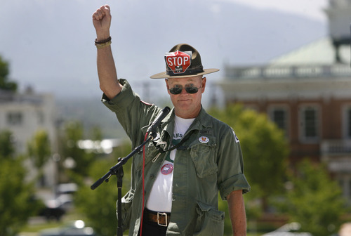 Scott Sommerdorf   |  The Salt Lake Tribune
Marine Corps veteran Aaron Davis speaks Saturday at the March Against Monsanto, a protest of the company's genetically modified foods held at the Utah State Capitol. Other demonstrations were held around the United States and in dozens of other countries.
