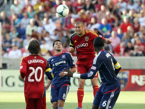 Kim Raff  |  The Salt Lake Tribune
(middle right) Real Salt Lake defender Chris Wingert (17) heads the ball over (middle left) Chicago Fire midfielder Dilly Duka (8) during the first half of the match at Rio Tinto Stadium in Sandy on May 25, 2013.