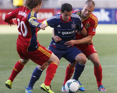 Kim Raff  |  The Salt Lake Tribune
(right) Real Salt Lake defender Chris Wingert (17) and (left) Real Salt Lake midfielder Ned Grabavoy (20) double team (middle) Chicago Fire midfielder Dilly Duka (8) during the first half of the match at Rio Tinto Stadium in Sandy on May 25, 2013.