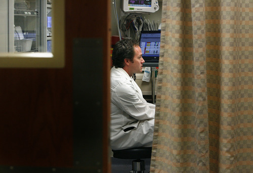 Scott Sommerdorf  |  The Salt Lake Tribune             
Scott Youngquist consults with a patient in the University of Utah Hospital emergency room. He and his peers are seeing an uptick in patients with untreated dental problems.