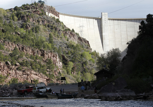 Al Hartmann  |  The Salt Lake Tribune

Flaming Gorge Dam as seen from the boat ramp on the Green River. The river, which meanders about 730 miles from its headwaters in the Wind River Range in Wyoming through Utah, Colorado and back into Utah, is No. 2 on the list of America's Most Endangered Rivers of 2012, according to a new report by American Rivers. The report cites proposed pipelines and a nuclear power plant that would remove huge portions of water as major threats to the river.