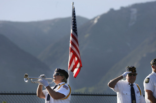 Scott Sommerdorf   |  The Salt Lake Tribune
An honor guard plays taps at the Memorial Day ceremony, at the Salem City Cemetery, Monday May 27, 2013. Salem is the hometown of Utah soldier Spc. Cody Towse, who died last week in Afghanistan.