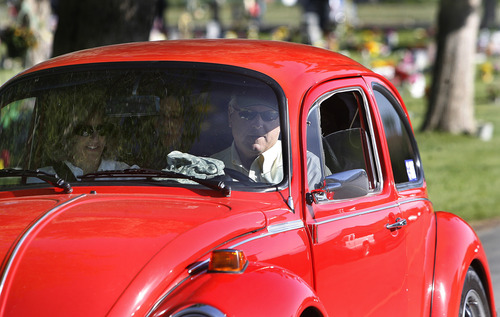 Scott Sommerdorf   |  The Salt Lake Tribune
With Cody's cap on the dashboard, the family of Utah soldier Spc. Cody Towse drives away from the Memorial Day ceremony at the Salem City Cemetery, Monday May 27, 2013 in Cody's VW Bug he was restoring. Salem is the hometown of Utah soldier Spc. Cody Towse, who died last week in Afghanistan.