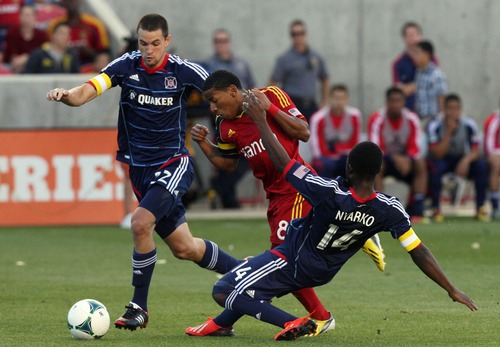 Kim Raff  |  The Salt Lake Tribune
(middle) Real Salt Lake forward Joao Plata (8) is double teamed by (left) Chicago Fire defender Austin Berry (22) and (right) Chicago Fire forward Patrick Nyarko (14) during the first half of the match at Rio Tinto Stadium in Sandy on May 25, 2013.