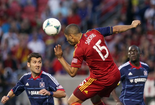 Kim Raff  |  The Salt Lake Tribune
(middle) Real Salt Lake forward Alvaro Saborio (15) heads the ball past (left) Chicago Fire defender Gonzalo Segares (13) during the second  half of the match at Rio Tinto Stadium in Sandy on May 25, 2013. The match ended in a 1-1 tie.