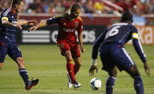 Kim Raff  |  The Salt Lake Tribune
(middle) Real Salt Lake forward Alvaro Saborio (15) looks for an opening past (left) Chicago Fire defender Austin Berry (22) and Chicago Fire defender Jalil Anibaba (6) during the second half of the match at Rio Tinto Stadium in Sandy on May 25, 2013. The match ended in a 1-1 tie.