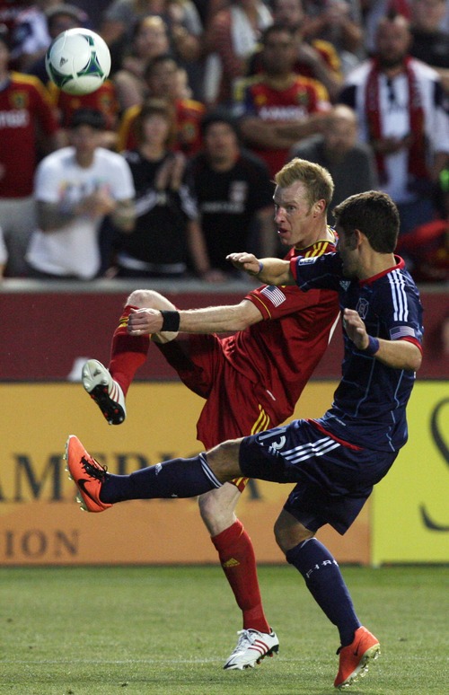 Kim Raff  |  The Salt Lake Tribune
(back) Real Salt Lake defender Nat Borchers (6) crosses the ball past (front) Chicago Fire defender Gonzalo Segares (13) during the second half of the match at Rio Tinto Stadium in Sandy on May 25, 2013. The match ended in a 1-1 tie.