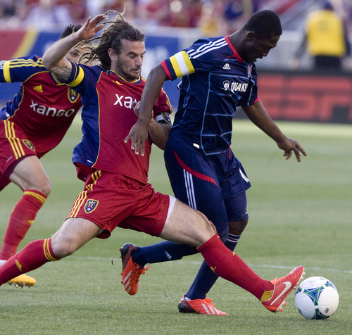 Kim Raff  |  The Salt Lake Tribune
(left) Real Salt Lake midfielder Kyle Beckerman (5) tips the ball away from the feet of (right) Chicago Fire forward Patrick Nyarko (14) during the first half of the match at Rio Tinto Stadium in Sandy on May 25, 2013.