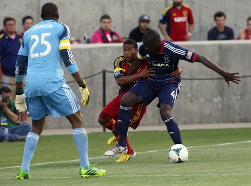 Kim Raff  |  The Salt Lake Tribune
(middle) Real Salt Lake forward Joao Plata (8) competes with (right) Chicago Fire defender Bakary Soumare (4) for a ball close to the goal as (left) Chicago Fire goalkeeper Sean Johnson (25) looks on during the first half of the match at Rio Tinto Stadium in Sandy on May 25, 2013.