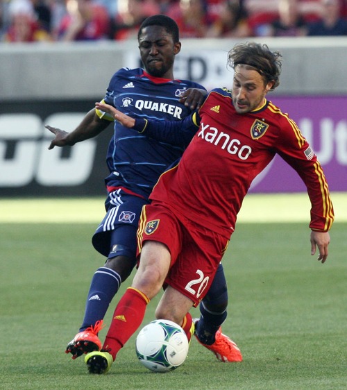 Kim Raff  |  The Salt Lake Tribune
(front) Real Salt Lake midfielder Ned Grabavoy (20) tries to hang on to the ball as (back) Chicago Fire forward Patrick Nyarko (14) attacks from behind during the first half of the match at Rio Tinto Stadium in Sandy on May 25, 2013.