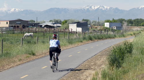 Al Hartmann  |  The Salt Lake Tribune
A bicycle rider takes some excercise along the Legacy Highway's multi use Bicycle/Pedestrian/Equestrian Trail near the Pages Lane Trailhead Tuesday May 21. Dozens of lead and arsenic samples along rails-to-trails routes, including the Denver & Rio Grande Trailhead along the Great Salt Lake and the Historic Union Pacific Trail in Park City, are up to 15 times higher than safe levels.