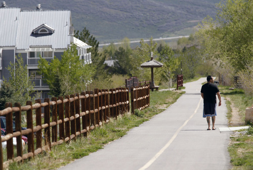 Al Hartmann  |  The Salt Lake Tribune
A walker takes in some excercise along Park City's Union Pacific Trail near Bonanza Drive Tuesday May 21. Dozens of lead and arsenic samples along rails-to-trails routes, including the Denver & Rio Grande Trailhead along the Great Salt Lake and the Historic Union Pacific Trail in Park City, are up to 15 times higher than safe levels.