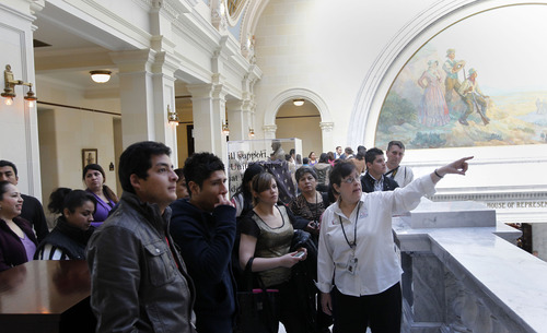 Al Hartmann  |  The Salt Lake Tribune
The Utah State Capitol's upcoming 100th anniversary is being celebrated with new displays. Sandra White, right, a retired school teacher, leads a tour of the Capitol to a group of tourists from Latin America Tuesday March 5.