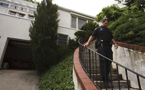 Leah Hogsten  |  The Salt Lake Tribune
Salt Lake City Police detective Andy Leonard leaves a home after talking with the owner who invites daytime burglars into his open garage in the Liberty Wells neighborhood that has seen a recent rash of burglaries, Wednesday, May 29, 2013.