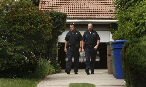 Leah Hogsten  |  The Salt Lake Tribune
l-r Salt Lake City Police detectives Andy Leonard and Rick Wall try to track down owners who invite daytime burglars into their open garages in the Liberty Wells neighborhood, an area that has seen a recent upswing of burglaries, Wednesday, May 29, 2013.