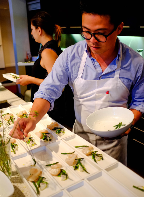 Trent Nelson  |  The Salt Lake Tribune
Viet Pham, co-owner of Forage, prepares a scallop/asparagus dish at a charity event in Salt Lake City where he and Takashi Gibo were the chefs, Wednesday May 15, 2013.