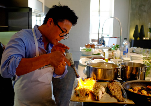 Trent Nelson  |  The Salt Lake Tribune
Viet Pham, co-owner of Forage, prepares a dish, Roasted Fish Family Style, at a charity event in Salt Lake City, Wednesday May 15, 2013.