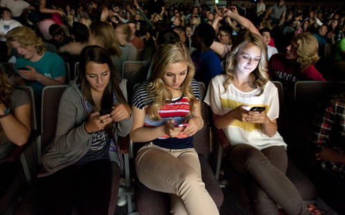 Steve Griffin | The Salt Lake Tribune
Students in the audience text in their votes during Alta High School's first "Hawk Tank" mobile app idea competition Friday.