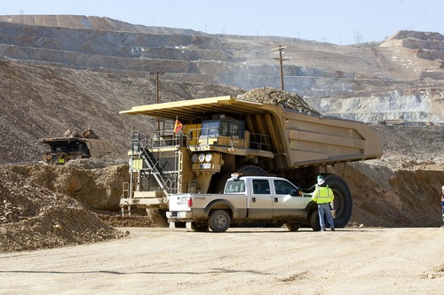 Al Hartmann  |  The Salt Lake Tribune
Heavy machinery removes debris last month from the landslide at Kennecott's Bingham Canyon mine.