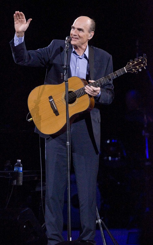 Paul Fraughton  |  The Salt Lake Tribune

James Taylor waves to an appreciative audience. Taylor and Carole King played at the EnergySolutions Arena to a sell out crowd Thursday evening.