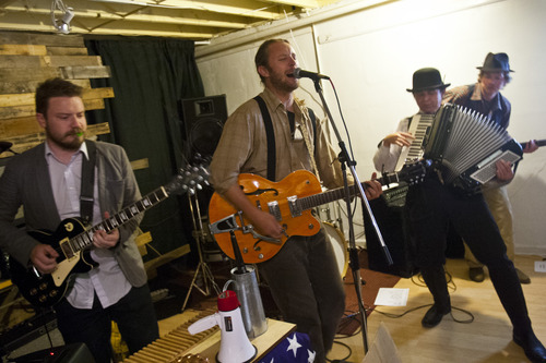 Chris Detrick  |  The Salt Lake Tribune
'Hectic Hobo' performs during a speakeasy-style art gallery party at Urban Vintage Thursday May 23, 2013. The gallery was featuring works from artist Teresa Flowers.