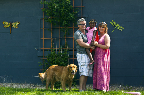 Chris Detrick  |  The Salt Lake Tribune
Cristy Gleave, Keri Jones, their daughter Glory Ella Gleave, 3, and their dog Molly Tomato at their home in Salt Lake City.