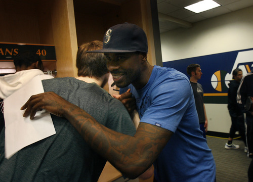 Scott Sommerdorf   |  The Salt Lake Tribune
Marvin Williams, right, hugs team mate Gordon Hayward as he leaves the Utah Jazz locker room. After losing in Memphis, and missing the playoffs, the Utah Jazz cleaned out their lockers and met with the press, Thursday, April 18, 2013.