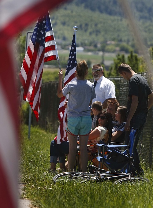 Leah Hogsten  |  The Salt Lake Tribune
Residents of Salem line the street leading to the Salem City Cemetery in a show of support for the Towse family. Funeral services for Army medic Cody Towse, who was killed by an improvised explosive device in Afghanistan May 14, were held at Salem Hills High School Saturday, June 1, 2013.