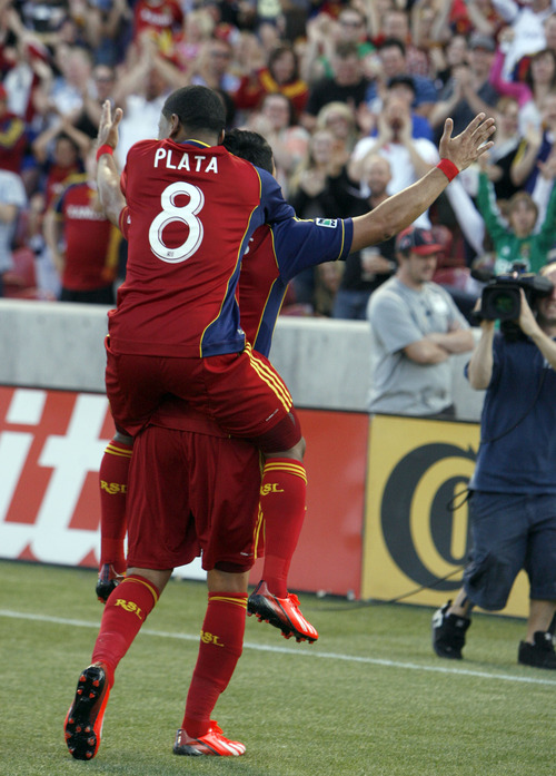 Francisco Kjolseth  |  The Salt Lake Tribune
Real Salt Lake's Javier Morales is cheered by fans as he is embraced by teammate Joao Plata after scoring the first goal against the San Jose Earthquakes on Saturday, June 1, 2013 at Rio Tinto Stadium in Sandy.