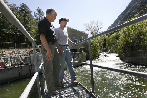 Scott Sommerdorf   |  The Salt Lake Tribune
Dan Stireman, Murray City Power energy services manager, left, speaks with Glenn Lundberg, Substation Generation Supervisor as they look at the waterflow to the diversion dam up Little Cottonwood Canyon. 
--
The 100th anniversary of Murray City Power, which is one of the oldest municipally owned utilities in the state and the only municipally owned utility in the Salt Lake Valley. When they were founded they built a small hydropower project near the mouth of Little Cottonwood Canyon., Wednesday, May 22, 2013.