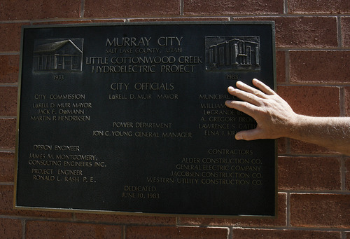 Scott Sommerdorf   |  The Salt Lake Tribune
Dan Stireman, Murray City Power energy services manager, has his hand on a plaque that commenorates the building of the building in 1983 that replaced the 1933 hydroelectric house, Wednesday, May 22, 2013.
---
The 100th anniversary of Murray City Power, which is one of the oldest municipally owned utilities in the state and the only municipally owned utility in the Salt Lake Valley. When they were founded they built a small hydropower project near the mouth of Little Cottonwood Canyon.