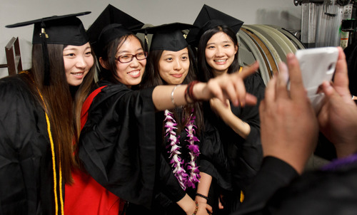 Trent Nelson  |  The Salt Lake Tribune
Graduates Haosu Ma, Yanfeng Zhou, Simeng Li and Xiao Yao Xiao pose for a photo during commencement for Westminster College at the Maverik Center in West Valley City Saturday June 1, 2013.