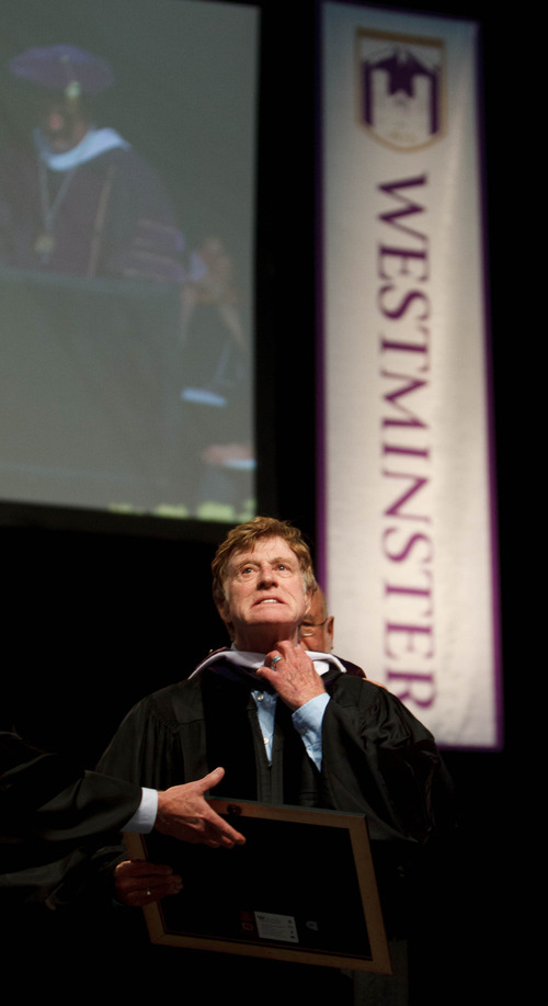 Trent Nelson  |  The Salt Lake Tribune
Actor and director Robert Redford jokingly grasps at his neck as he receives an honorary doctorate in arts and public service and the accompanying hood at commencement exercises for Westminster College at the Maverik Center in West Valley City Saturday June 1, 2013.